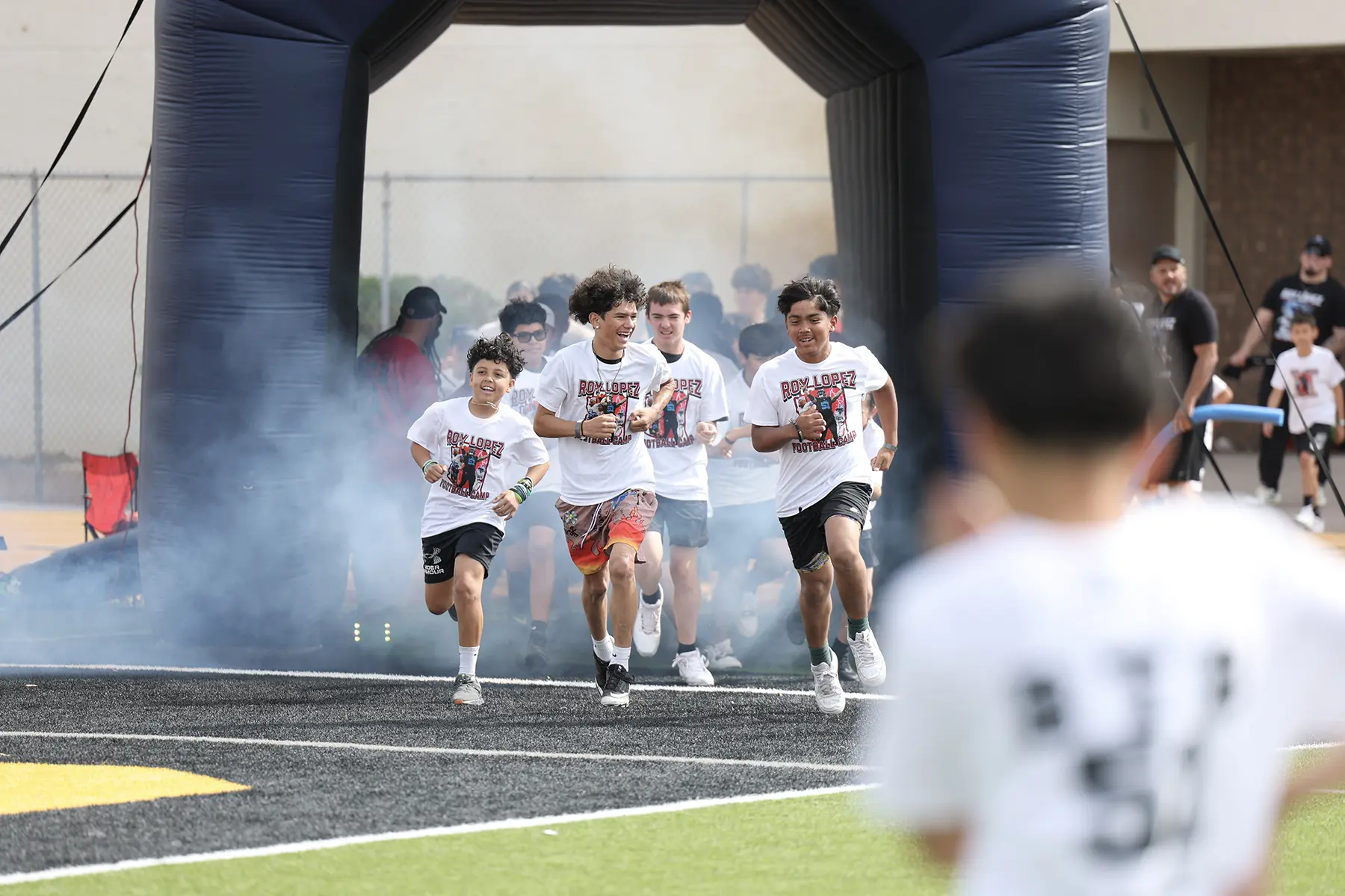 Campers headed onto the field at the Roy Lopez Camp
